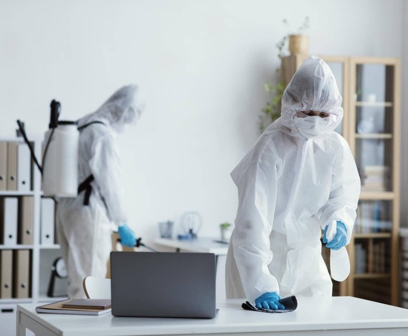 people in hazmat cleaning